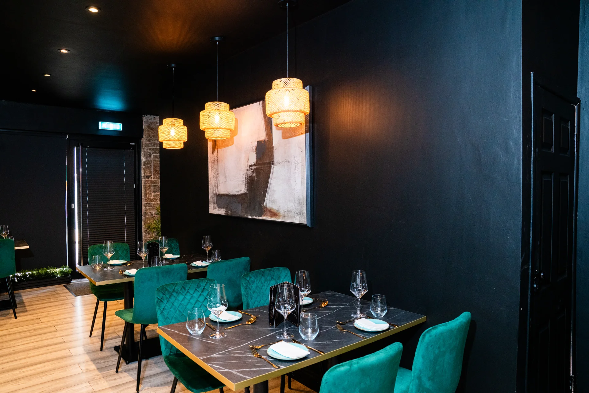 Cravorii restaurant ambiance — pendant lights and art